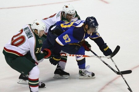 ST. LOUIS - SEPTEMBER 24: David Perron #57 of the St. Louis Blues looks to get past Antti Miettinen #20 and Marek Zidlicky #3 both of the Minnesota Wild during a pre-season game at the Scottrade Center on September 24, 2010 in St. Louis, Missouri.  <br /><br /><span class="help">(Photo by Dilip Vishwanat/Getty Images)</span>