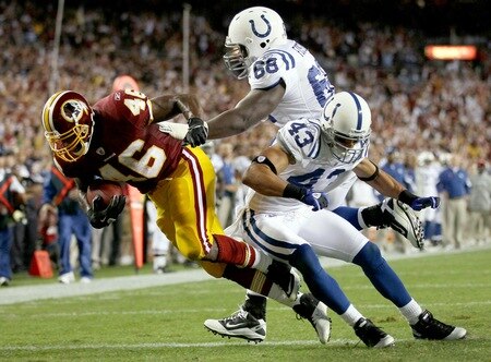 LANDOVER, MD - OCTOBER 17: Running back Ryan Torain #46 of the Washington Redskins scores a touchdown against Eric Foster #68 and Aaron Francisco #23 of the Indianapolis Colts at FedExField on October 17, 2010 in Landover, Maryland.  <br /><br /><span class="help">(Photo by Win McNamee/Getty Images)</span>