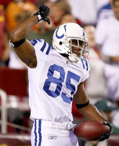 LANDOVER, MD - OCTOBER 17:  Reggie Wayne #85 celebrates scoring a touchdown in the first quarter against the Washington Redskins at FedExField on October 17, 2010 in Landover, Maryland.  <br /><br /><span class="help">(Photo by Win McNamee/Getty Images)</span>