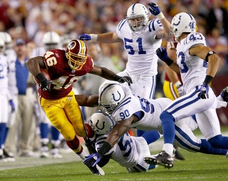 LANDOVER, MD - OCTOBER 17:  Running back Ryan Torain #46 of the Washington Redskins is gang tackled by the Indianapolis Colts defense at FedExField on October 17, 2010 in Landover, Maryland.  <br /><br /><span class="help">(Photo by Win McNamee/Getty Images)</span>
