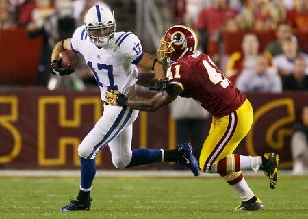 LANDOVER, MD - OCTOBER 17: Austin Collie #17 of the Indianapolis Colts moves the ball upfield after making a reception against Kareem Moore #41 of the Washington Redskins at FedExField on October 17, 2010 in Landover, Maryland.  <br /><br /><span class="help">(Photo by Win McNamee/Getty Images)</span>