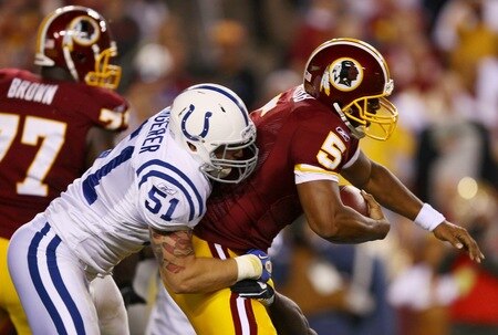 LANDOVER, MD - OCTOBER 17:  Quarterback Donovan McNabb #5 of the Washington Redskins is sacked by Pat Angerer #51 of the Indianapolis Colts in first quarter action at FedExField on October 17, 2010 in Landover, Maryland.  <br /><br /><span class="help">(Photo by Win McNamee/Getty Images)</span>