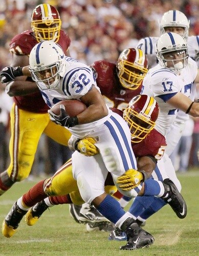 LANDOVER, MD - OCTOBER 17:  Running back Mike Hart #32 of the Indianapolis Colts is tackled by London Fletcher #59 of the Washington Redskins at FedEx Field on October 17, 2010 in Landover, Maryland. The Colts won the game 27-24.  <br /><br /><span class="help">(Photo by Win McNamee/Getty Images)</span>