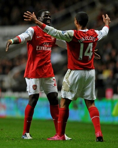 NEWCASTLE UPON TYNE, ENGLAND - OCTOBER 27:  Theo Walcott of Arsenal celebrates scoring his team's second goal with team mate Emmanuel Eboue during the Carling Cup Fourth Round match between Newcastle United and Arsenal at St James' Park on October 27, 2010 in Newcastle, England.  <br /><br /><span class="help">(Photo by Laurence Griffiths/Getty Images)</span>