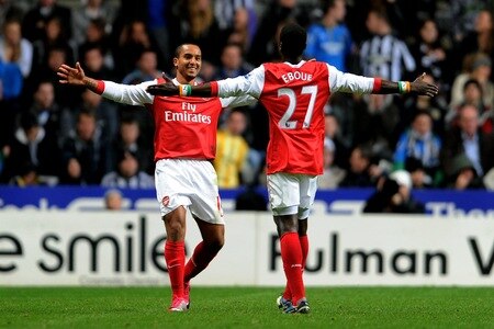 NEWCASTLE UPON TYNE, ENGLAND - OCTOBER 27:  Theo Walcott of Arsenal celebrates scoring his team's second goal with team mate Emmanuel Eboue during the Carling Cup Fourth Round match between Newcastle United and Arsenal at St James' Park on October 27, 2010 in Newcastle, England.  <br /><br /><span class="help">(Photo by Michael Regan/Getty Images)</span>