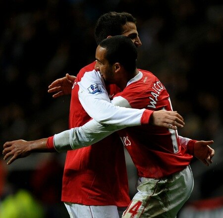 NEWCASTLE UPON TYNE, ENGLAND - OCTOBER 27:  Theo Walcott of Arsenal celebrates scoring his team's fourth goal with team mate Cesc Fabregas during the Carling Cup Fourth Round match between Newcastle United and Arsenal at St James' Park on October 27, 2010 in Newcastle, England.  <br /><br /><span class="help">(Photo by Laurence Griffiths/Getty Images)</span>