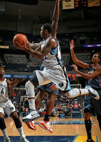 MEMPHIS, TN - DECEMBER 15: O.J. Mayo #32 of the Memphis Grizzlies passes around Kwame Brown #54 of the Charlotte Bobcats on December 15, 2010 at FedExForum in Memphis, Tennessee.  <br /><br /><span class="help">(Photo by Joe Murphy/NBAE via Getty Images)</span>