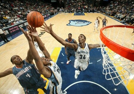 MEMPHIS, TN - DECEMBER 15: Darrell Arthur #00 and Hasheem Thabeet #34 of the Memphis Grizzlies rebound against Derrick Brown #4 of the Charlotte Bobcats on December 15, 2010 at FedExForum in Memphis, Tennessee.  <br /><br /><span class="help">(Photo by Joe Murphy/NBAE via Getty Images)</span>