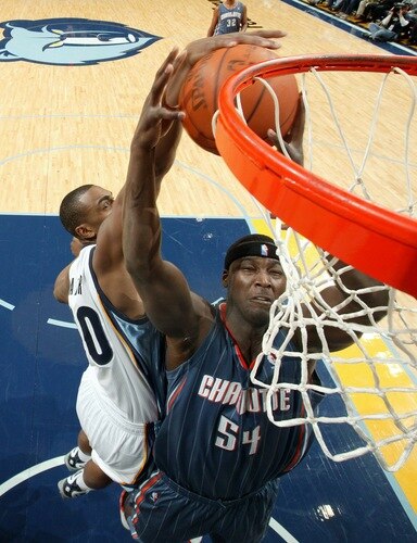 MEMPHIS, TN - DECEMBER 15: Darrell Arthur #00 of the Memphis Grizzlies attempts to block a shot by Kwame Brown #54 of the Charlotte Bobcats on December 15, 2010 at FedExForum in Memphis, Tennessee.  <br /><br /><span class="help">(Photo by Joe Murphy/NBAE via Getty Images)</span>