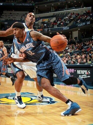 MEMPHIS, TN - DECEMBER 15: Tyrus Thomas #12 of the Charlotte Bobcats drives around Darrell Arthur #00 of the Memphis Grizzlies on December 15, 2010 at FedExForum in Memphis, Tennessee.  <br /><br /><span class="help">(Photo by Joe Murphy/NBAE via Getty Images)</span>
