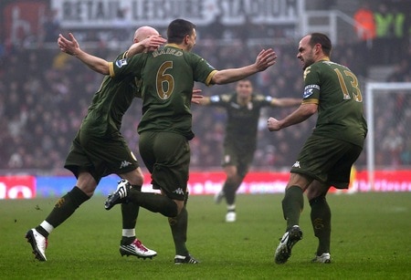 STOKE ON TRENT, ENGLAND - DECEMBER 28:  Chris Baird of Fulham celebrates with team mates after scoring his second goal from a free kick during the Barclays Premier League match between Stoke City and Fulham at Britannia Stadium on December 28, 2010 in Stoke on Trent, England.  <br /><br /><span class="help">(Photo by Clive Brunskill/Getty Images)</span>