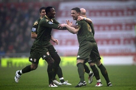 STOKE ON TRENT, ENGLAND - DECEMBER 28:  Chris Baird of Fulham celebrates with team mates after scoring his second goal from a free kick during the Barclays Premier League match between Stoke City and Fulham at Britannia Stadium on December 28, 2010 in Stoke on Trent, England.  <br /><br /><span class="help">(Photo by Clive Brunskill/Getty Images)</span>