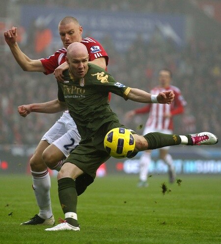 STOKE ON TRENT, ENGLAND - DECEMBER 28:  Andrew Johnson of Fulham is tackled by Andy Wilkinson of Stoke City during the Barclays Premier League match between Stoke City and Fulham at Britannia Stadium on December 28, 2010 in Stoke on Trent, England.  <br /><br /><span class="help">(Photo by Clive Brunskill/Getty Images)</span>