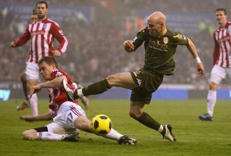 STOKE ON TRENT, ENGLAND - DECEMBER 28:  Andrew Johnson of Fulham is tackled by Ryan Shawcross of Stoke City during the Barclays Premier League match between Stoke City and Fulham at Britannia Stadium on December 28, 2010 in Stoke on Trent, England.  <br /><br /><span class="help">(Photo by Clive Brunskill/Getty Images)</span>