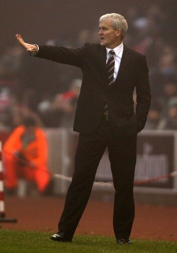 STOKE ON TRENT, ENGLAND - DECEMBER 28: Fulham manager Mark Hughes gives instructions to his team during the Barclays Premier League match between Stoke City and Fulham at Britannia Stadium on December 28, 2010 in Stoke on Trent, England.  <br /><br /><span class="help">(Photo by Clive Brunskill/Getty Images)</span>