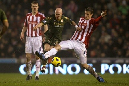 STOKE ON TRENT, ENGLAND - DECEMBER 28:  Andrew Johnson of Fulham is tackled by Robert Huth of Stoke City during the Barclays Premier League match between Stoke City and Fulham at Britannia Stadium on December 28, 2010 in Stoke on Trent, England.  <br /><br /><span class="help">(Photo by Clive Brunskill/Getty Images)</span>