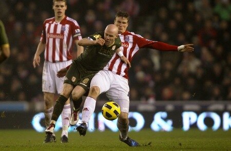 STOKE ON TRENT, ENGLAND - DECEMBER 28:  Andrew Johnson of Fulham is tackled by Robert Huth of Stoke City during the Barclays Premier League match between Stoke City and Fulham at Britannia Stadium on December 28, 2010 in Stoke on Trent, England.  <br /><br /><span class="help">(Photo by Clive Brunskill/Getty Images)</span>