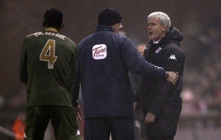 STOKE ON TRENT, ENGLAND - DECEMBER 28:  Fulham manager Mark Hughes is calmed down during the Barclays Premier League match between Stoke City and Fulham at Britannia Stadium on December 28, 2010 in Stoke on Trent, England.  <br /><br /><span class="help">(Photo by Clive Brunskill/Getty Images)</span>