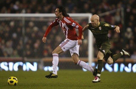 STOKE ON TRENT, ENGLAND - DECEMBER 28: Tuncay of Stoke City attempts to move away with the ball from Andrew Johnson of Fulham during the Barclays Premier League match between Stoke City and Fulham at Britannia Stadium on December 28, 2010 in Stoke on Trent, England.  <br /><br /><span class="help">(Photo by Clive Brunskill/Getty Images)</span>