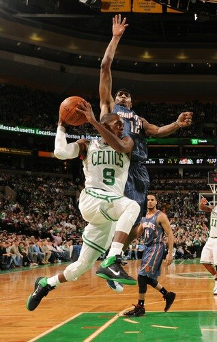 BOSTON, MA - JANUARY 14:  Rajon Rondo #9 of the Boston Celtics drives the lane against Tyrus Thomas #12 of the Charlotte Bobcats on January 14, 2011 at the TD Garden in Boston, Massachusetts.  <br />
<br />
(Photo by Brian Babineau/NBAE via Getty Images)