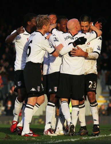 LONDON, ENGLAND - JANUARY 22:  Goalscorer Clint Dempsey (R) of Fulham is kissed by Andrew Johnson during the Barclays Premier League match between Fulham and Stoke City at Craven Cottage on January 22, 2011 in London, England.  <br /><br /><span class="help">(Photo by Clive Rose/Getty Images)</span>