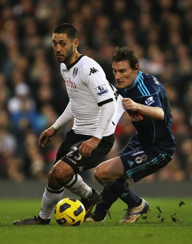 LONDON, ENGLAND - JANUARY 22:  Clint Dempsey of Fulham is held back by Dean Whitehead of Stoke City during the Barclays Premier League match between Fulham and Stoke City at Craven Cottage on January 22, 2011 in London, England.  <br /><br /><span class="help">(Photo by Clive Rose/Getty Images)</span>