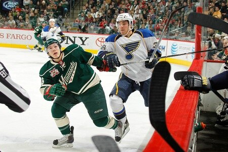 SAINT PAUL, MN - FEBRUARY 12: Jared Spurgeon #46 of the Minnesota Wild and Matt D'Agostini #36 of the St. Louis Blues skate to the puck after it is deflected into the air during the game at Xcel Energy Center on February 12, 2011 in Saint Paul, Minnesota.  <br /><br /><span class="help">(Photo by Bruce Kluckhohn/NHLI via Getty Images)</span>
