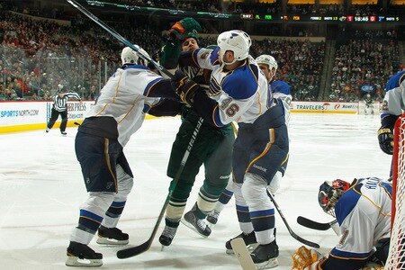 SAINT PAUL, MN - FEBRUARY 12: (L-R) Barret Jackman #5 and Roman Polak #46 of the St. Louis Blues keep Kyle Brodziak #21 of the Minnesota Wild away from their goal during the game at Xcel Energy Center on February 12, 2011 in Saint Paul, Minnesota.  <br /><br /><span class="help">(Photo by Bruce Kluckhohn/NHLI via Getty Images)</span>