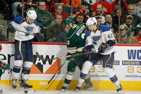 SAINT PAUL, MN - FEBRUARY 12: Eric Nystrom #23 of the Minnesota Wild fights for control of the puck with (L-R) Cam Janssen #55 and David Backes #42 of the St. Louis Blues during the game at Xcel Energy Center on February 12, 2011 in Saint Paul, Minnesota.  <br /><br /><span class="help">(Photo by Bruce Kluckhohn/NHLI via Getty Images)</span>