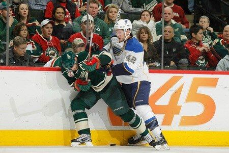 SAINT PAUL, MN - FEBRUARY 12: Mikko Koivu #9 of the Minnesota Wild and David Backes #42 of the St. Louis Blues battle for the puck during the game at Xcel Energy Center on February 12, 2011 in Saint Paul, Minnesota.  <br /><br /><span class="help">(Photo by Bruce Kluckhohn/NHLI via Getty Images)</span>