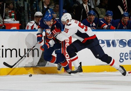 UNIONDALE, NY - FEBRUARY 26:  Jeff Schultz #55 of the Washington Capitals tries to slow down John Tavares #91 of the New York Islanders on February 26, 2011 at Nassau Coliseum in Uniondale, New York.  <br /><br /><span class="help">(Photo by Mike Stobe/NHLI via Getty Images)</span>