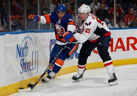 UNIONDALE, NY - FEBRUARY 26:  PA Parenteau #15 of the New York Islanders tries to get away from Jeff Schultz #55  of the Washington Capitals on February 26, 2011 at Nassau Coliseum in Uniondale, New York.  <br /><br /><span class="help">(Photo by Mike Stobe/NHLI via Getty Images)</span>
