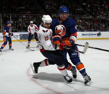 UNIONDALE, NY - FEBRUARY 26: Ty Wishart #6 of the New York Islanders steps into Boyd Gordon #15 of the Washington Capitals at the Nassau Coliseum on February 26, 2011 in Uniondale, New York.  <br /><br /><span class="help">(Photo by Bruce Bennett/Getty Images)</span>