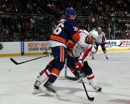 UNIONDALE, NY - FEBRUARY 26: Travis Hamonic #36 of the New York Islanders hits Jason Chimera #25 of the Washington Capitals at the Nassau Coliseum on February 26, 2011 in Uniondale, New York.  <br /><br /><span class="help">(Photo by Bruce Bennett/Getty Images)</span>
