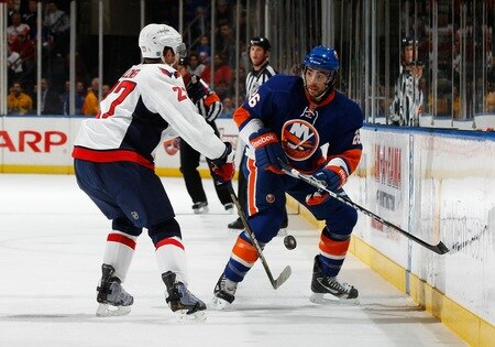 UNIONDALE, NY - FEBRUARY 26:  Matt Moulson #26 of the New York Islanders gets ready for a check from Karl Alzner #27 of the Washington Capitals on February 26, 2011 at Nassau Coliseum in Uniondale, New York.  <br /><br /><span class="help">(Photo by Mike Stobe/NHLI via Getty Images)</span>
