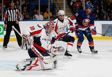 UNIONDALE, NY - FEBRUARY 26:  Goaltender Michal Neuvirth #30 of the Washington Capitals makes a save as teammate Boyd Gordon #15 tries to defend against John Tavares #91 of the New York Islanders on February 26, 2011 at Nassau Coliseum in Uniondale, New York.  <br /><br /><span class="help">(Photo by Mike Stobe/NHLI via Getty Images)</span>