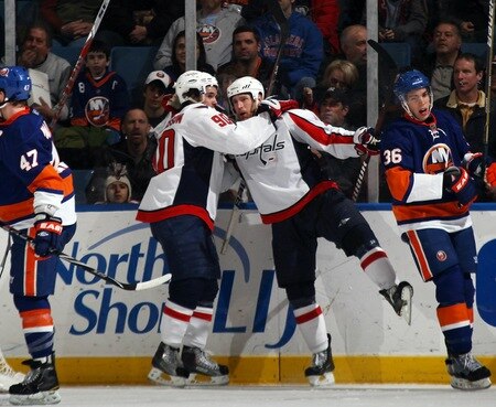 UNIONDALE, NY - FEBRUARY 26: Marcus Johansson #90 (L) of the Washington Capitals congratulates Brooks Laich #21 (R) on his goal at 9:44 of the second period against the New York Islanders at the Nassau Coliseum on February 26, 2011 in Uniondale, New York.  <br /><br /><span class="help">(Photo by Bruce Bennett/Getty Images)</span>
