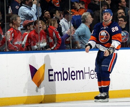 UNIONDALE, NY - FEBRUARY 26: Zenon Konopka #28 of the New York Islanders leaves the ice following a fight with Matt Hendricks #26 of the Washington Capitals (not shown) at the Nassau Coliseum on February 26, 2011 in Uniondale, New York.  <br /><br /><span class="help">(Photo by Bruce Bennett/Getty Images)</span>