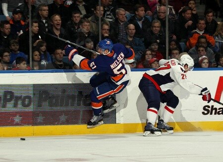 UNIONDALE, NY - FEBRUARY 26: Frans Nielsen #51 of the New York Islanders squeezes past Karl Alzner #27 of the Washington Capitals at the Nassau Coliseum on February 26, 2011 in Uniondale, New York.  <br /><br /><span class="help">(Photo by Bruce Bennett/Getty Images)</span>