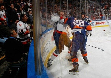 UNIONDALE, NY - FEBRUARY 26:  Fans watch as Matt Hendricks #26 of the Washington Capitals fights Zenon Konopka #28 of the New York Islanders on February 26, 2011 at Nassau Coliseum in Uniondale, New York.  <br /><br /><span class="help">(Photo by Mike Stobe/NHLI via Getty Images)</span>