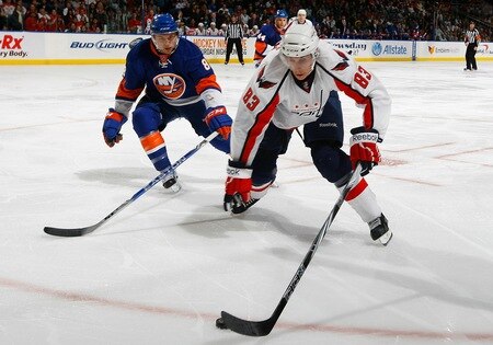 UNIONDALE, NY - FEBRUARY 26:  Jay Beagle #83 of the Washington Capitals tries to get away from Bruno Gervais #8 of the New York Islanders on February 26, 2011 at Nassau Coliseum in Uniondale, New York.  <br /><br /><span class="help">(Photo by Mike Stobe/NHLI via Getty Images)</span>