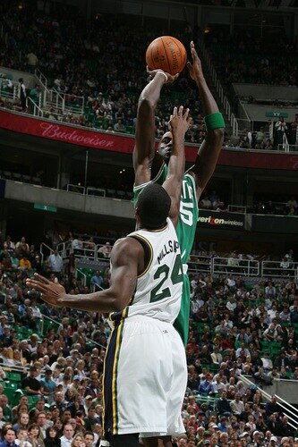 SALT LAKE CITY, UT - FEBRUARY 28:  Kevin Garnett #5 of the Boston Celtics puts the shot up over Paul Millsap #24 of the Utah Jazz at EnergySolutions Arena on February 28, 2011 in Salt Lake City, Utah. <br />
<br />
(Photo by Melissa Majchrzak/NBAE via Getty Images)