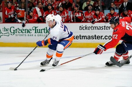 WASHINGTON, DC - MARCH 01:  Mark Katic #71 of the New York Islanders controls the puck against Mike Knuble #22 of the Washington Capitals at the Verizon Center on March 1, 2011 in Washington, DC.  <br /><br /><span class="help">(Photo by Greg Fiume/Getty Images)</span>
