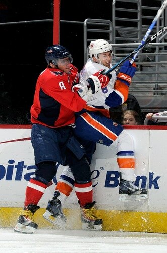 WASHINGTON, DC - MARCH 01:  Alex Ovechkin #8 of the Washington Capitals checks Bruno Gervais #8 of the New York Islanders at the Verizon Center on March 1, 2011 in Washington, DC.  <br /><br /><span class="help">(Photo by Greg Fiume/Getty Images)</span>