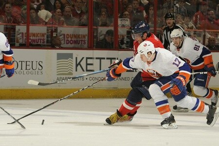 WASHINGTON, DC - MARCH 1:  Matt Martin #17 of the New York Islanders and Alex Ovechkin #8 of the Washington Capitals go after a loose puck during a NHL hockey game on March 1, 2011 at the Verizon Center in Washington, DC.  <br /><br /><span class="help">(Photo by Mitchell Layton/NHLI via Getty Images)</span>