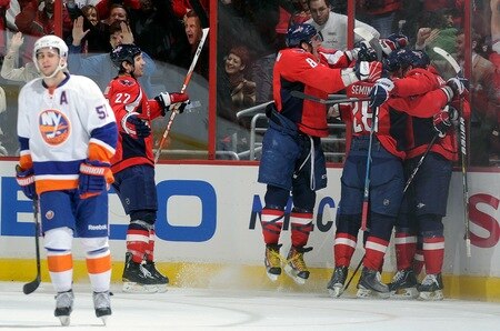 WASHINGTON, DC - MARCH 01:  Brooks Laich #21 of the Washington Capitals is mobbed by teammates after scoring in the third period against the New York Islanders at the Verizon Center on March 1, 2011 in Washington, DC.  <br /><br /><span class="help">(Photo by Greg Fiume/Getty Images)</span>