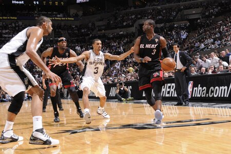 SAN ANTONIO, TX - MARCH 4:  Dwyane Wade #3 of the Miami Heat looks to pass against George Hill #3 of the San Antonio Spurs at AT&T Center on March 4, 2011 in San Antonio, Texas. <br /><br /><span class="help">(Photos by D. Clarke Evans/NBAE via Getty Images)</span>