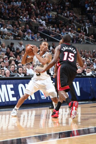 SAN ANTONIO, TX - MARCH 4:  George Hill #3 of the San Antonio Spurs looks to pass against Mario Chalmers #15 of the Miami Heat at AT&T Center on March 4, 2011 in San Antonio, Texas. <br /><br /><span class="help">(Photo by Alissa Hollimon/NBAE via Getty images)</span>