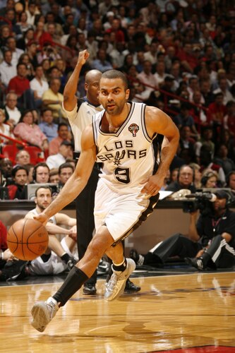 MIAMI - MARCH 14: Tony Parker #9 of the San Antonio Spurs drives against the Miami Heat on March 14, 2011 at American Airlines Arena in Miami, Florida. <br /><br /><span class="help">(Photo by Issac Baldizon/NBAE via Getty Images)</span>