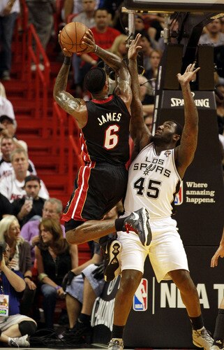MIAMI - MARCH 14:  Forward LeBron James #6 of the Miami Heat shoots against DeJuan Blair #45 of  the San Antonio Spurs at American Airlines Arena on March 14, 2011 in Miami, Florida. <br /><br /><span class="help">(Photo by Marc Serota/Getty Images)</span>